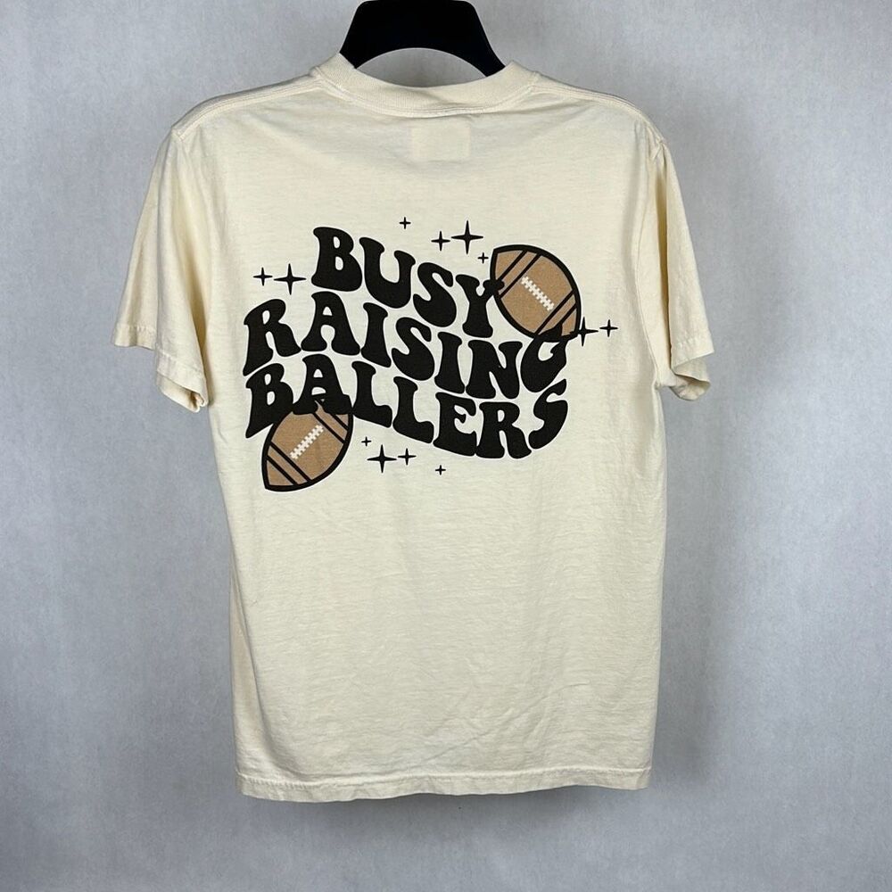 NEW Comfort Colors Football Tshirt Busy Raising Ballers Sz Small Beige Short Sle